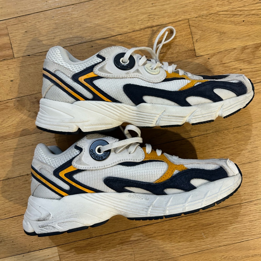 Adidas White and Dark Blue Sneakers with Gold Highlights